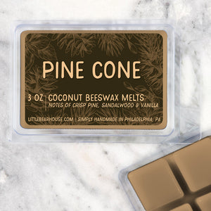 3 oz Pine Cone beeswax and coconut wax melt on Marble background. Notes of crisp pine, sandalwood & vanilla. Simply handmade in Philadelphia, PA.