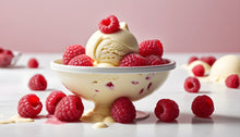 Load image into Gallery viewer, Vanilla ice cream with raspberries in and around the bowl
