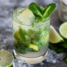 Load image into Gallery viewer, rocks glass filled with ice, mint, limes and mojito. Mojito wax scent
