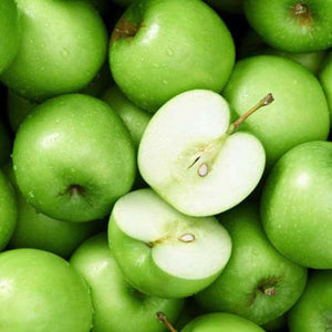 Fresh picked Granny Smith apples with one sliced in half to show crisp interior, green apple wax scent