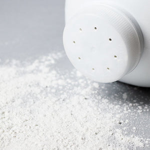 White Baby Powder Spilled on a Gray Table Wax Scent