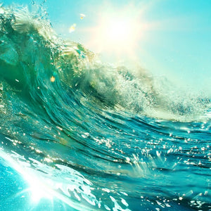 Riding a blue wave on the beach water rolling in the eye of the wave under sunshine at the beach wax scent